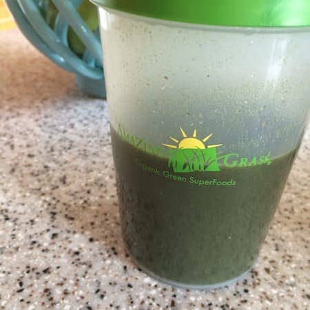 green superfood drink with warm water and honey